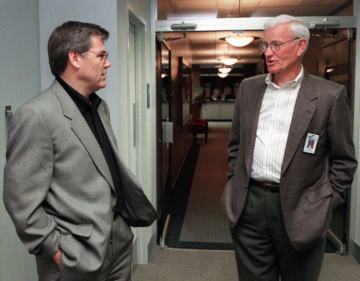 New WWP CEO Tom Matthews talks with Paul Redmond outsdie the executive offices at WWP. Redmond joined with the late Spokesman-Review Publisher William H. Cowles 3rd and local banker Dave Clack to form Momentum 87, a group that sought to attract new jobs and raise Spokane wages. (Shawn Jacobson / The Spokesman-Review)