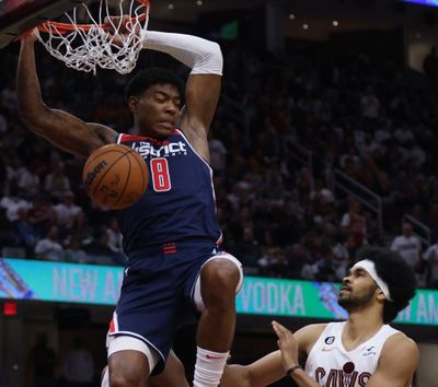 Wizards forward Rui Hachimura dunks over Cleveland Cavaliers center Jarrett Allen during a game at Rocket Mortgage FieldHouse on Sunday, October 23, 2022.  (Tribune News Service)