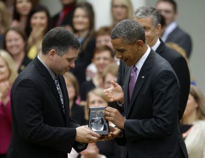 National honor for Washington teacher: President Barack Obama presents the 2013 National Teacher of the Year award to Jeff Charbonneau, who teaches at Zillah High School in Zillah, Wash., during a ceremony in the Rose Garden of the White House on Tuesday. (Associated Press)
