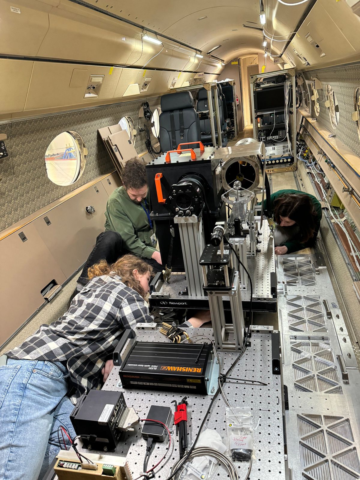 Scientists and technicians install the Airborne Coronal Emission Surveyor instrument onto the NSF NCAR Gulfstream V on March 11, 2024, at the NSF NCAR Research Aviation Facility in Broomfield, Colorado. (Rosalyn Stilling/University Center for Atmospheric Research/TNS)  (University Center for Atmospheric Research/TNS)