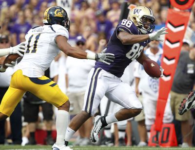 Washington’s Austin Seferian-Jenkins, right, isn’t going to be caught by California’s Sean Cattouse. (Associated Press)