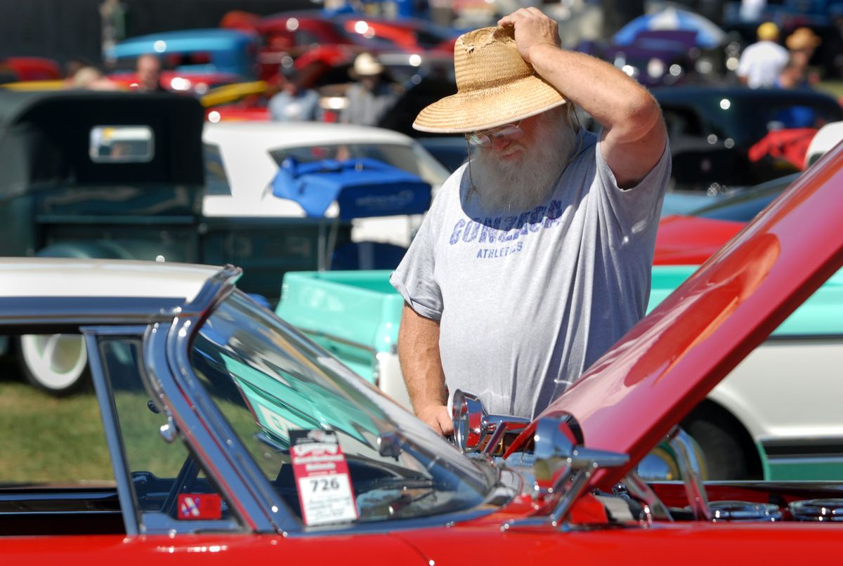Pancho Simonson, of Spokane, looks at a 1957 Dodge Custom Royal Lancer at the Good Guys 7th Great Northwest Nationals car show Friday at the Spokane Fair and Expo Center. The show brought more than 1,000 classic cars from 10 states for a three-day celebration of American car culture.  (Photos by Jesse Tinsley / The Spokesman-Review)