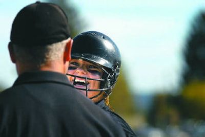 
Shadle Park junior Sam Skillingstad, who pitched a two-hit, 5-0 shutout against University, talks to first base coach Guy Perham. 
 (Jed Conklin / The Spokesman-Review)