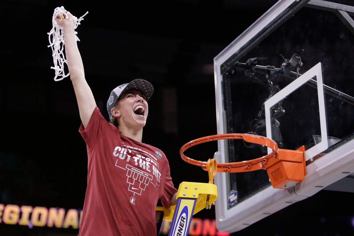 Stanford guard Lexie Hull cuts down the net after a win over Texas in the Elite 8 round of the NCAA tournament on March 27 in Spokane.  (Associated Press)