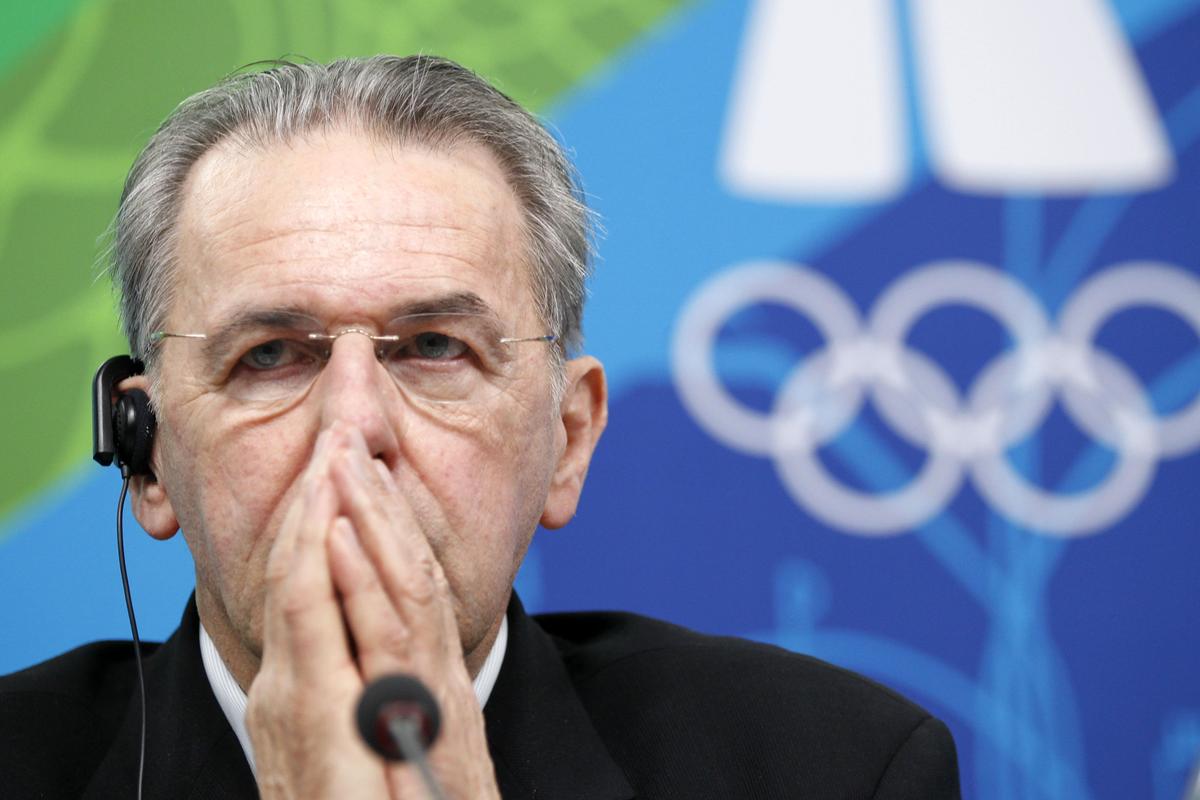 Jacques Rogge took four questions at a 7-minute news conference about the tragedy. (Associated Press)