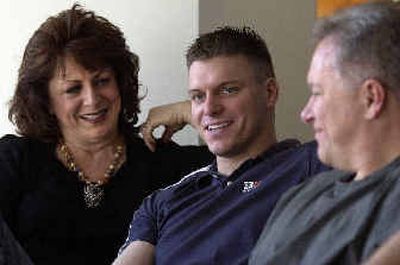 
Louise Keneally and her husband, Robert, spend time with their son, 1st Lt. Sean Keneally, center, who is home from Mosul, Iraq, in the Spokane Valley for two weeks. 
 (Liz Kishimoto / The Spokesman-Review)