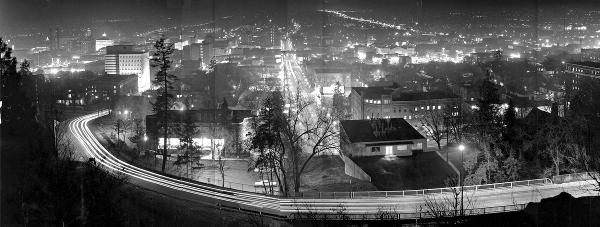 1966: To create this panoramic view from Cliff Drive looking north across Spokane, Spokane Chronicle photographers “stitched” four photos together. Division Street is the line of lights at top right. (Photo archive)