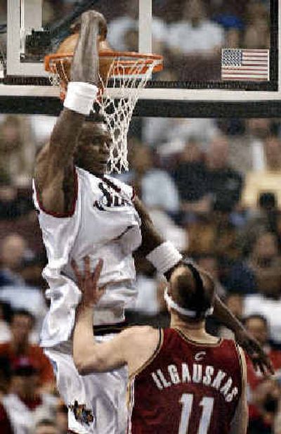 
76ers' Samuel Dalembert finds basketball provides an escape for his worries about Haiti, though he has made large donations to help provide relief for that country.
 (Associated Press / The Spokesman-Review)