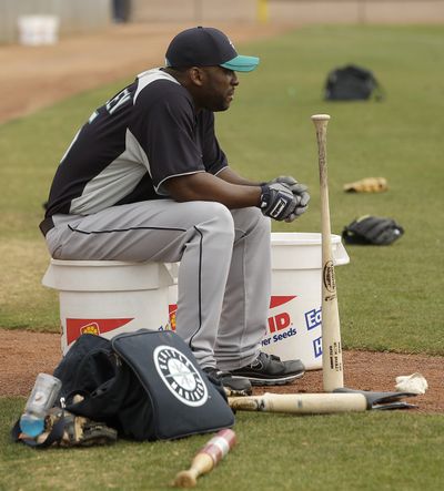 Milton Bradley waits for his turn at batting practice at spring training on Friday. (Associated Press)