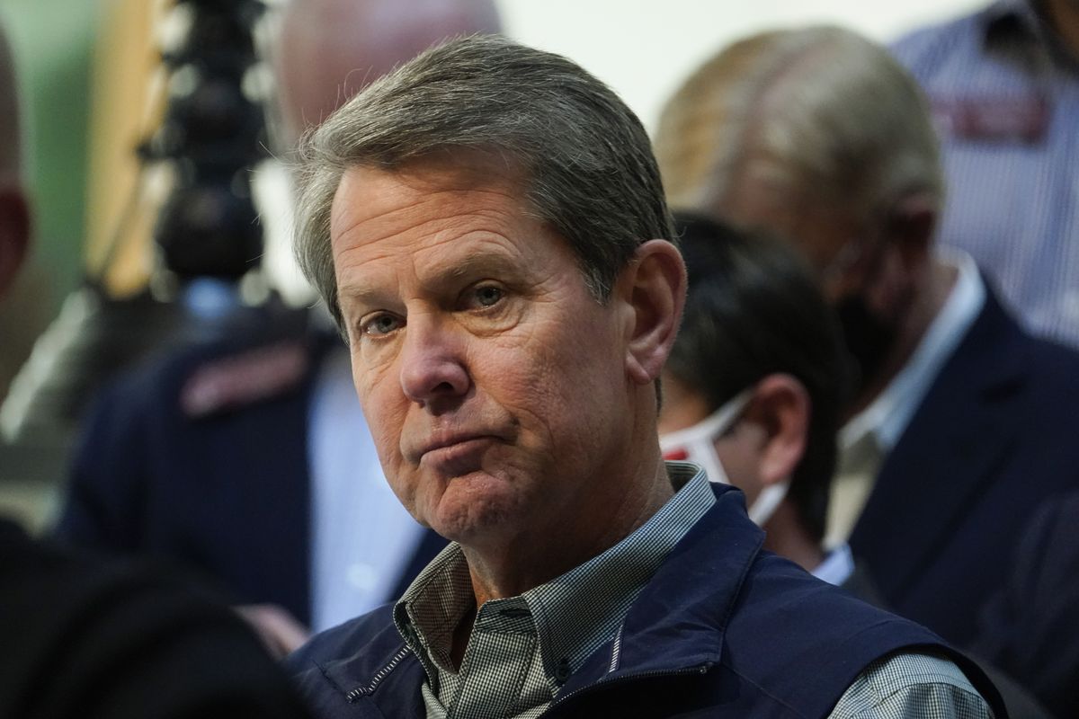 Georgia Gov. Brian Kemp listens to a question during a news conference at the State Capitol on Saturday, April 3, 2021, in Atlanta, about Major League Baseball