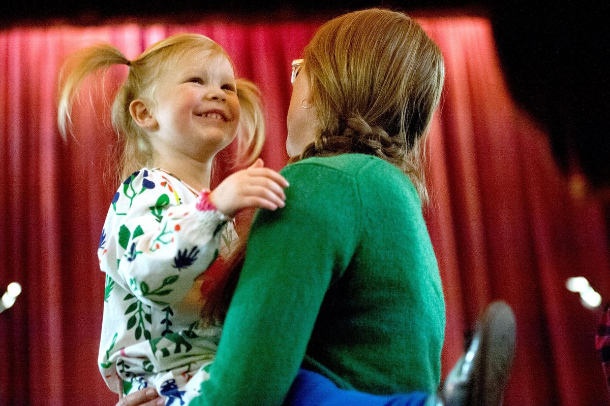 Millie Flynn, 3, dances with her mother Candice during the KPBX kid