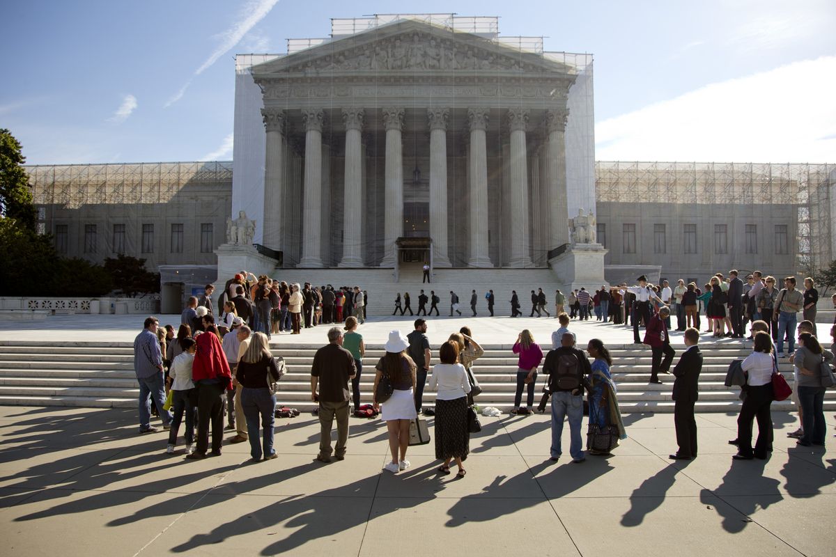 People wait in line to enter the Supreme Court in Washington, Monday, Oct. 1, 2012. The Supreme Court is embarking on a new term that could be as consequential as the last one with the prospect for major rulings about affirmative action, gay marriage and voting rights. (Carolyn Kaster / Associated Press)