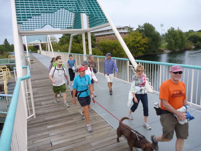 Hikers cross the Don Kardong Bridge on the Centennial Trail near Gonzaga University. (Rich Landers)