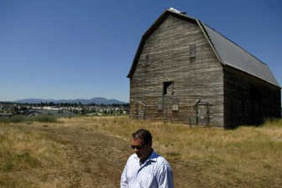 
Dennis Cunningham says the barn on the site of a planned housing development in Coeur d'Alene will be moved about 75 feet onto a new foundation at a cost of about  $100,000. Cunningham said he's heard from people interested in turning the barn into a restaurant or office space.
 (Kathy Plonka / The Spokesman-Review)