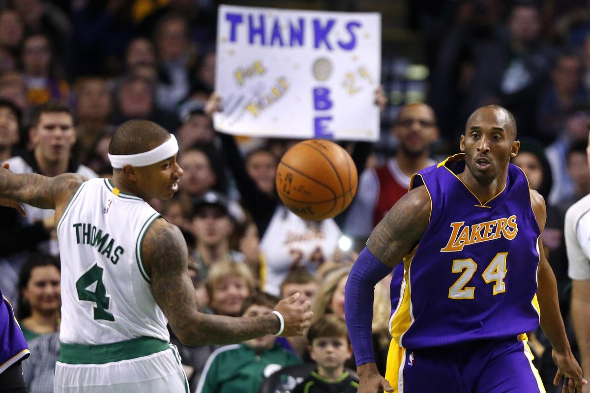 This Dec. 30, 2015 file photo shows Los Angeles Lakers’ Kobe Bryant and Boston Celtics’ Isaiah Thomas eyeing a loose ball during the second half of an NBA basketball game in Boston. In the afterglow of scoring 53 points against the Washington Wizards, Thomas says hes been talking and texting with Bryant to get tips about his game. Thomas says after the Celtics were down 2-0 in the first round to Chicago, he emailed film to Bryant and the retired Lakers star went over it for 30 minutes with him over the phone. (Winslow Townson / Associated Press)