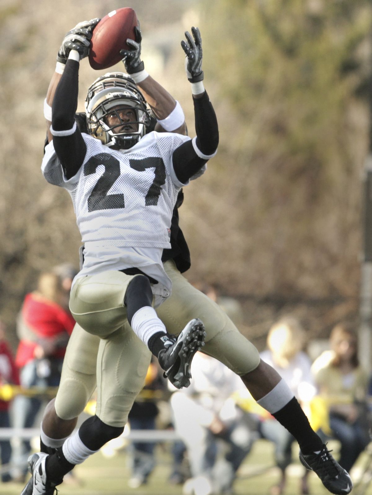 Safety Issac Butts attempts to intercept a pass intended for wide receiver Preston Davis. (Tyler Tjomsland / The Spokesman-Review)