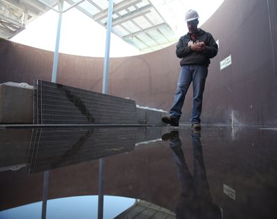 The Department of Energy’s Erik Olds works inside a mockup of a Hanford Nuclear Reservation tank.  (Associated Press)