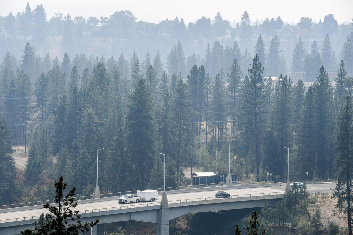 Wildfire smoke shrouds the hills around the T.J. Meenach Bridge, Bridge, Tuesday, Aug. 3, 2021, in Spokane.  (DAN PELLE/THE SPOKESMAN-REVIEW)