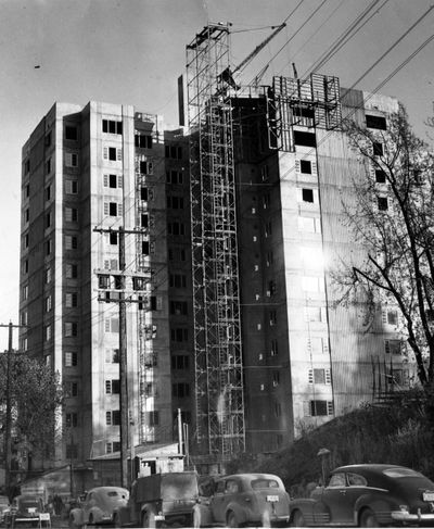 In this 1951 file photo, Spokane's Cooper-George apartment at Fifth and Wall is nearing completion. The roof was poured 10 days ago, and interiors of the first four floors are finished. J.L. Cooper, coowner of the $1,750,000 building with Henry George & Sons, said tenants would move in by January. The 13-story apartment house is the largest ever to be built in Spokane. Whitehouse & Price are the architects, and Henry George, the contractor. (PHOTO ARCHIVE / SR)