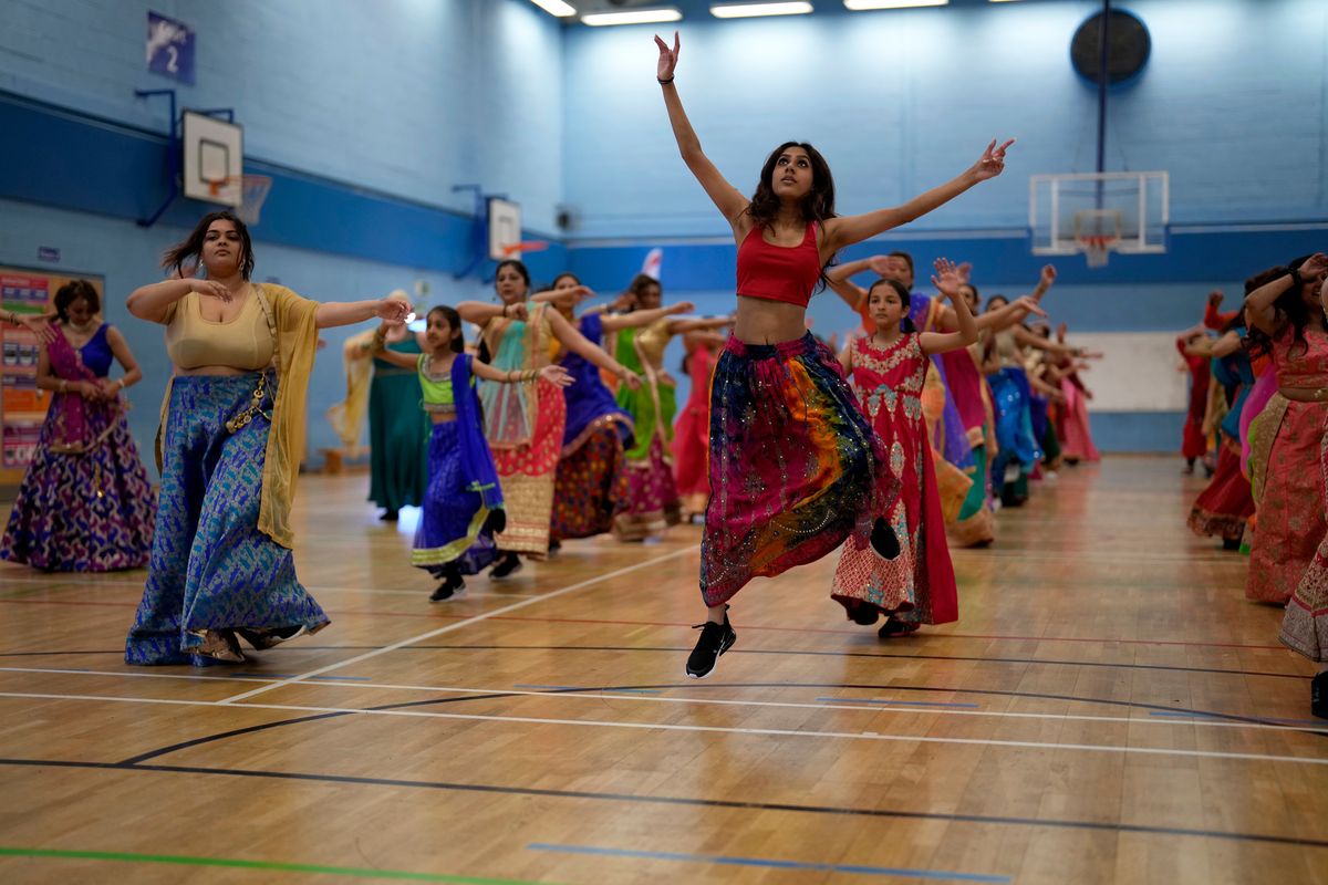Performers take part in a rehearsal for the Nutkhut creative company ahead of their upcoming Bollywood style performance entitled “The Wedding Party”, which will be part of the procession at the Platinum Jubilee Pageant, at Northolt High School, in north west London, May 29.  (Matt Dunham)