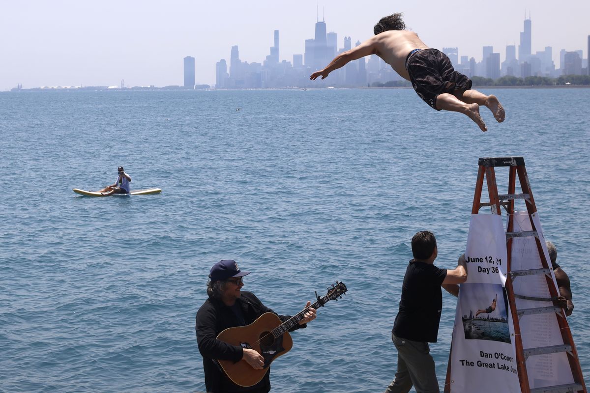 Dan O’Conor, the “Great Lake Jumper,” makes his 365th leap Saturday into Lake Michigan at Montrose Point.  (Shafkat Anowar)