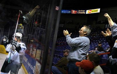 
A small contingent of Silvertips fans in the Arena Wednesday night cheers one of Everett's four first-period goals against the Spokane Chiefs in Western Hockey League play. 
 (Jed Conklin / The Spokesman-Review)