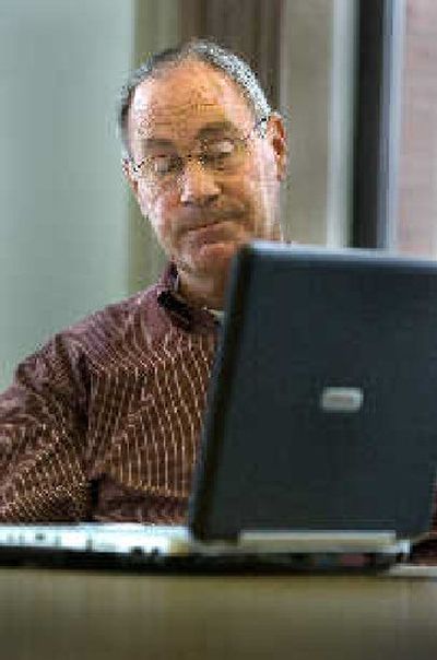 
Mike Pannek shows some emotion during a presentation of photos and videos from his work over 15 months in Iraq.  
 (Christopher Anderson/ / The Spokesman-Review)