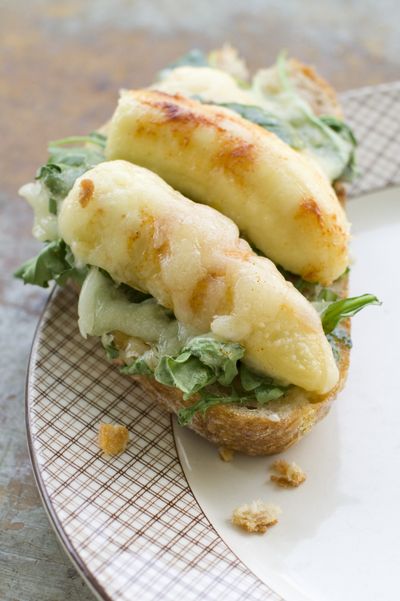 Before serving, toast Banana-Manchego Bruschetta for 4 to 5 minutes, or until the cheese starts to brown. (Associated Press)