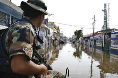 
Troops patrol the flooded streets in Villahermosa, Mexico, on Monday.Associated Press
 (Associated Press / The Spokesman-Review)