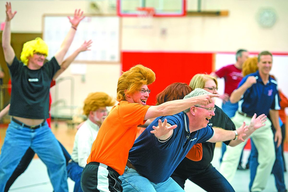 Anthony Dutton points the way for Clark Bergerud as they participate in the mixed tap Scooby-Doo performance during a Ham on Regal practice Wednesday in the Ferris High School gym. (Dan Pelle)