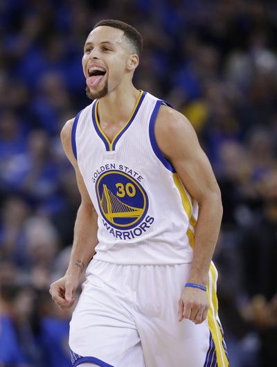 Golden State’s Stephen Curry enjoys romps over Spurs on Monday. (Marcio Jose Sanchez / Associated Press)