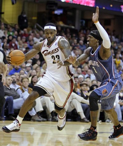 LeBron James drives past Charlotte’s Gerald Wallace in Saturday night’s NBA game in Cleveland. The host Cavaliers won 90-79. (Associated Press / The Spokesman-Review)