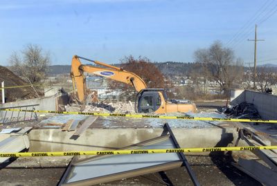 Demolition continued Wednesday of the former Spokane Valley Senior Citizen Center at Mission Park.  (J. BART RAYNIAK / The Spokesman-Review)