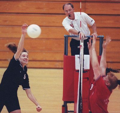 Official Dale Goodwin watches action as Idaho’s Mindy Rice spikes the ball against Eastern Washington during a 1994  Big Sky Conference match in Cheney. (PELLE / SR)