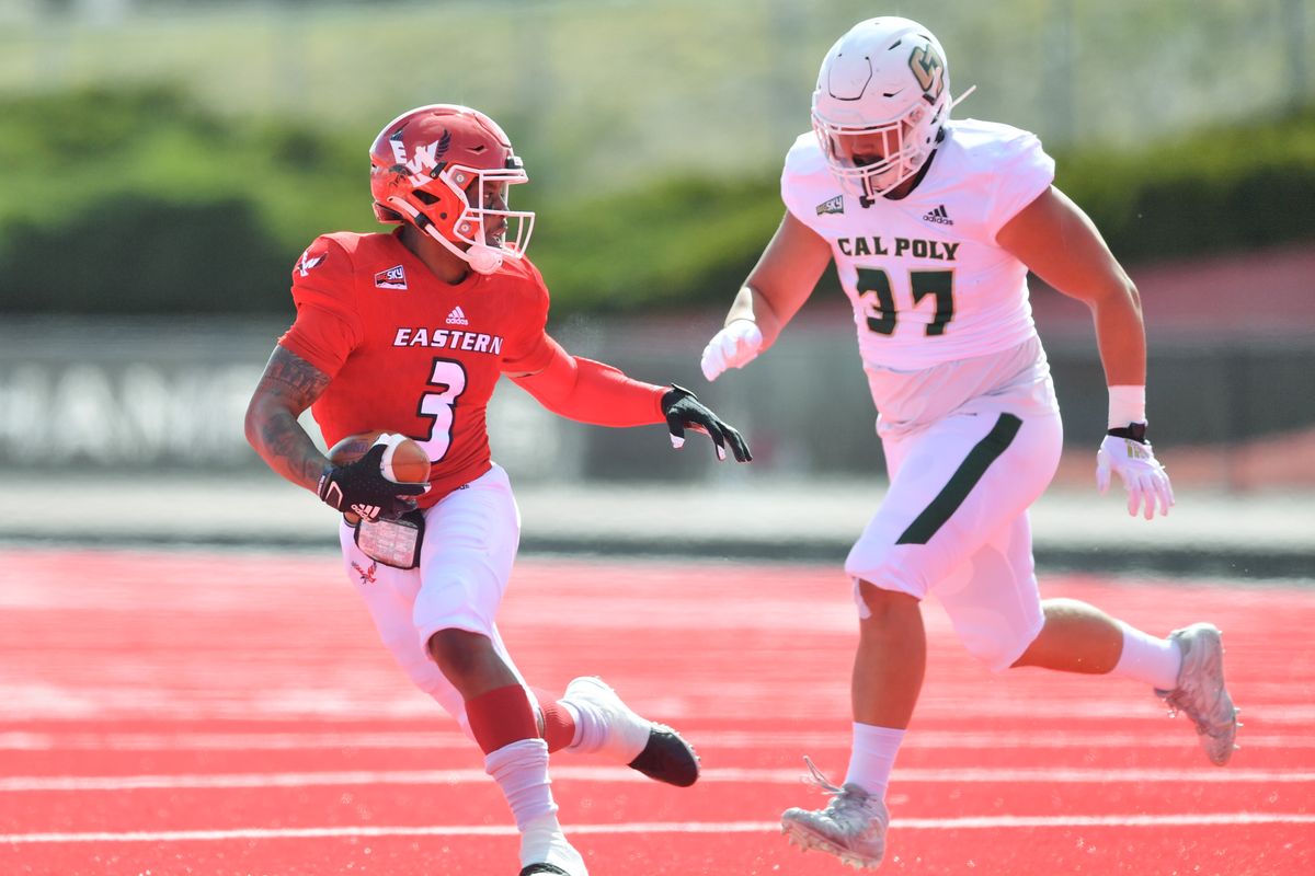 Eastern Washington Eagles quarterback Eric Barriere (3) evades Cal Poly Mustangs defensive end Ryan Boehm (37) during the first half of a college football game on Saturday, March 27, 2021, at Roos Field in Cheney, Wash.  (Tyler Tjomsland/The Spokesman-Review)