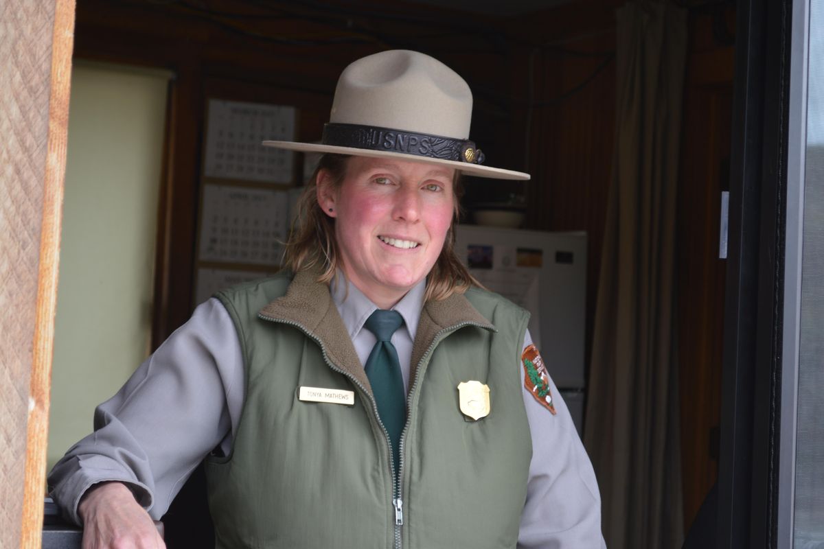 In this April 28, 2017, photo, Tonya Mathews, who has worked as the supervisor of the north entrance to Yellowstone National Park since 2009, poses for a photo in Gardiner, Mont. The park recorded its busiest year in visits in 2017. (Michael Wright / AP)