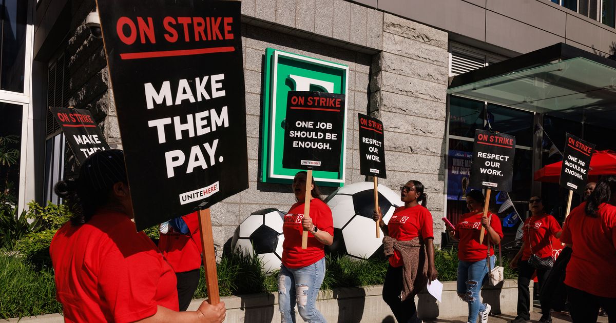 Hilton union workers in Pioneer Square strike during FIFA World Cup