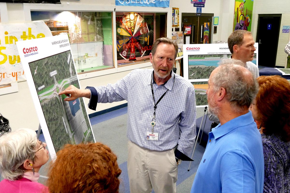 Peter Kahn, of Costco, talks Wednesday, May 31, 2017, at Northwood Middle School with neighbors about a proposed roundabout on Highway 2 to allow access to the new Costco store. The  public meeting  gave residents access to representatives of Costco and Washington Department of Transportation who answered questions about the project. (Jesse Tinsley / The Spokesman-Review)