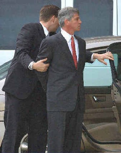 
Former Enron finance chief Andrew Fastow is taken away in handcuffs in this file photo. He is one of 30 ex-Enron employees charged following the firm's collapse. 
 (File/Associated Press / The Spokesman-Review)