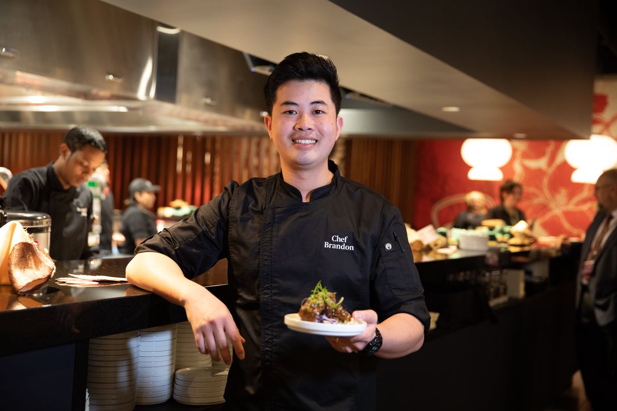 Chef Brandon Pham leads the kitchen of the newly opened East Pan Asian Cuisine at Northern Quest Resort & Casino. Pham is pictured here holding sweet and sour spare pork ribs during a sneak preview last Thursday.  (Courtesy of Ari Nordhagen)