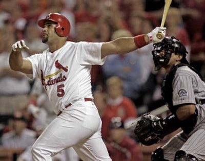 
Albert Pujols of the St. Louis Cardinals connects for his major league-leading 17th home run of the season Tuesday against Colorado. He hit No. 18 Wednesday. 
 (Associated Press / The Spokesman-Review)