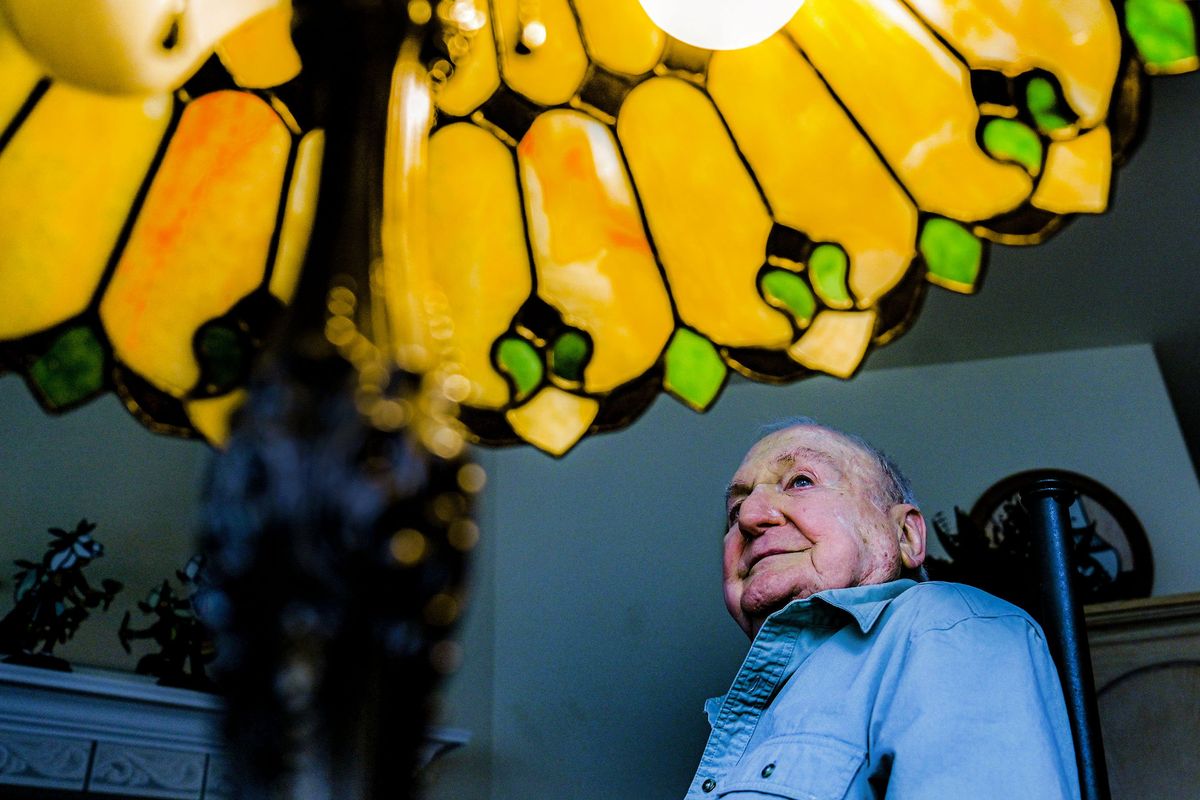 “This is my first one,” says glass artisan Thomas Arico as he looks at the first stained glass lamp shade he made at his home in Coeur d’Alene on Wednesday.  (Kathy Plonka/The Spokesman-Review)