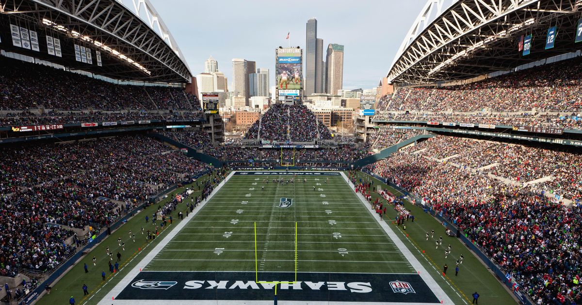 Construction on the Seattle Seahawks' new stadium continues Wednesday,  March 27, 2002, in this view looking north toward downtown Seattle. The  team will begin playing in the 67,000-seat stadium this fall. The