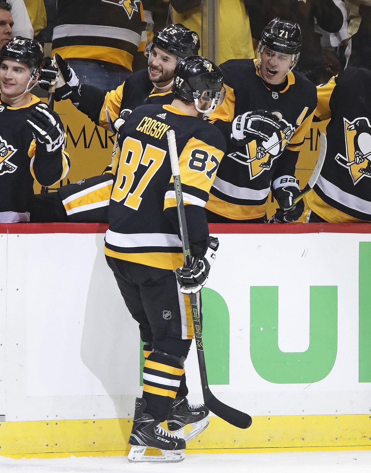 Pittsburgh Penguins’ Sidney Crosby (87) celebrates his goal as he returns to the bench during the second period in Game 1 of an NHL first-round hockey playoff series against the Philadelphia Flyers in Pittsburgh, Wednesday, April 11, 2018. (Gene J. Puskar / Associated Press)