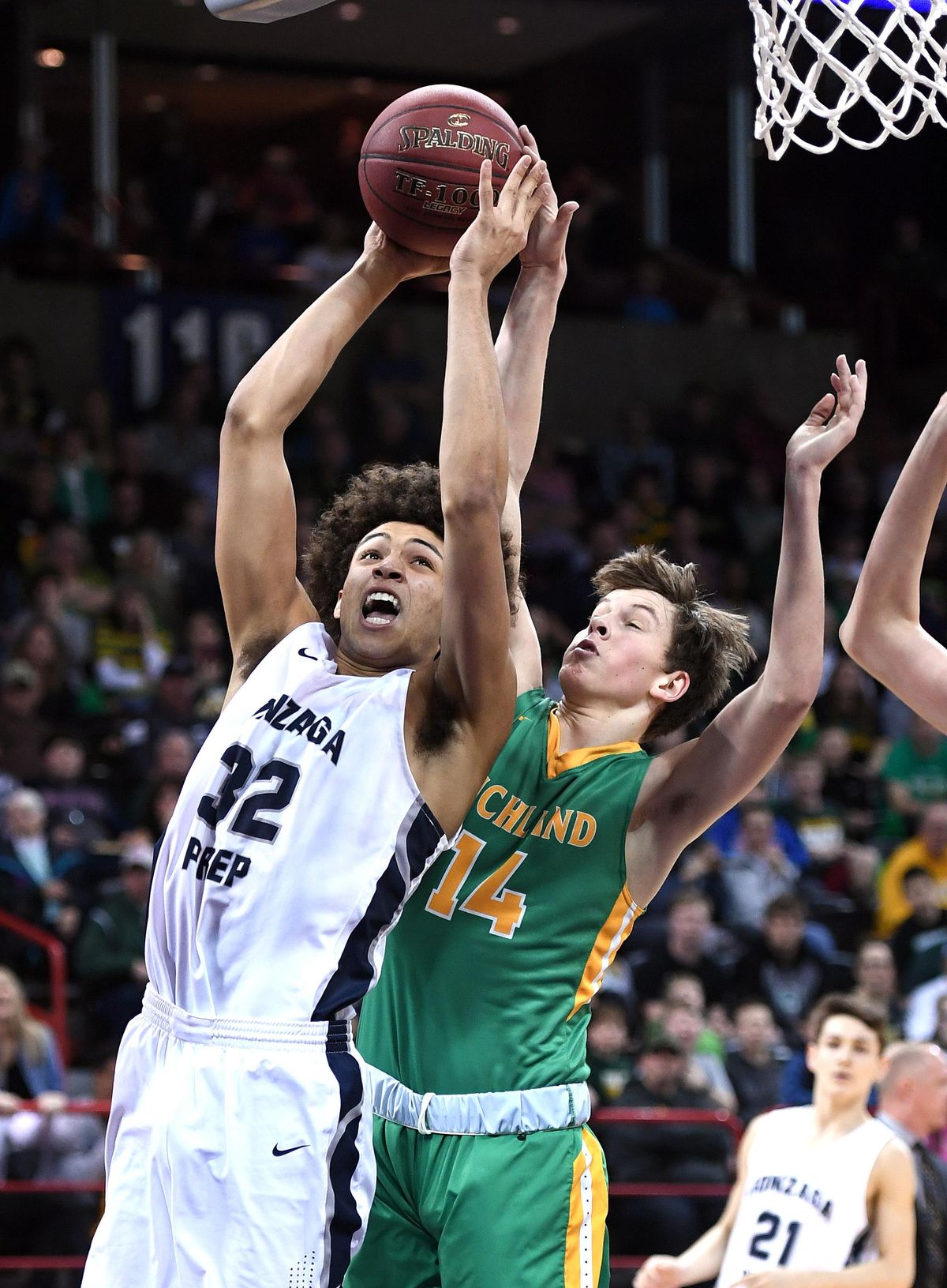 Gonzaga Prep’s Anton Watson drives as Richland’s Garrett Streufert defends during the District 8 4A title game last Friday  at the Spokane Arena. (Colin Mulvany / The Spokesman-Review)