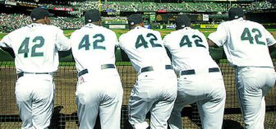 The Mariners were well represented in paying tribute to Jackie Robinson by wearing his No. 42. From left, are: Jason Ellison, Arthur Rhodes, Miguel Batista, Jose Lopez and Adrian Beltre.
(Associated Press / The Spokesman-Review)