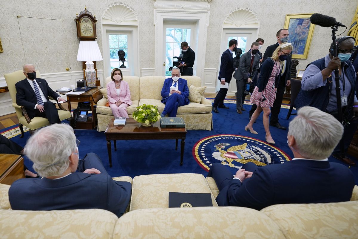 Members of the media are escorted out as President Joe Biden meets with congressional leaders in the Oval Office of the White House, Wednesday, May 12, 2021, in Washington. Clockwise from left, Biden, House Speaker Nancy Pelosi of Calif., and Senate Majority Leader Chuck Schumer of N.Y., Senate Minority Leader Mitch McConnell of Ky., and House Minority Leader Kevin McCarthy of Calif.  (Evan Vucci)
