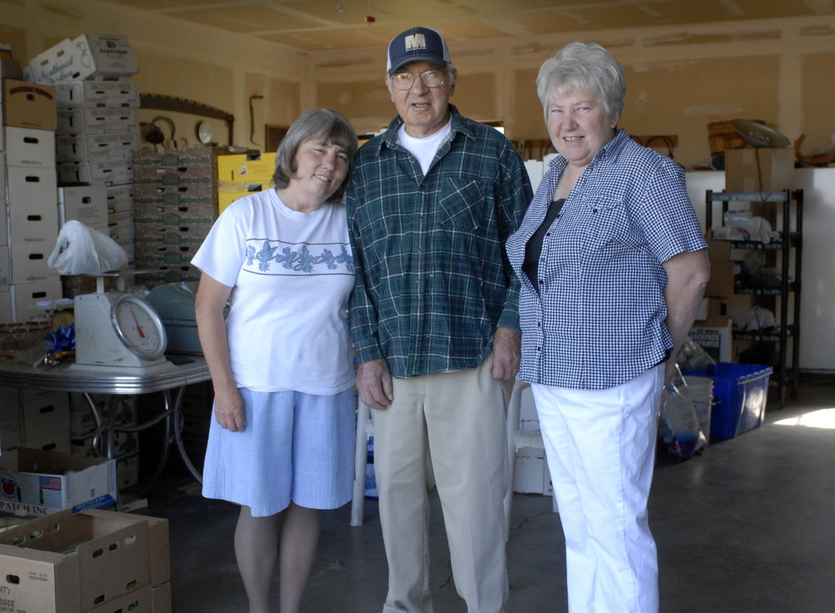 The Spokesman-Review Elmer Utecht’s sisters Carla Thurlow, left, and Rhonda Utecht, pick all the vegatables that go to the Spokane Valley Yoke’s store. They also help him operate his produce stand. (J. BART RAYNIAK / The Spokesman-Review)
