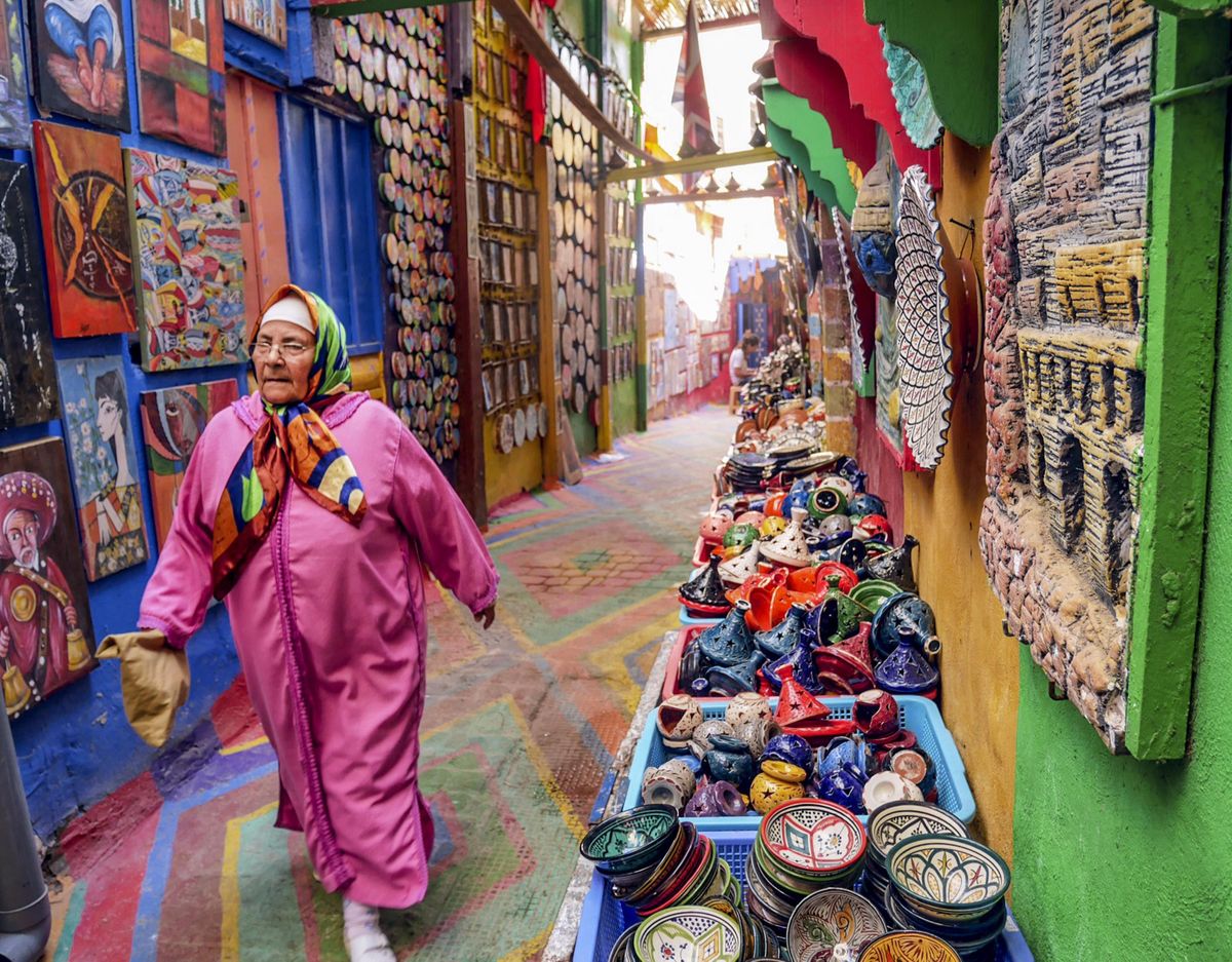 A woman walks down a gaily painted alley in the ancient walled city in Fez. (Bob Drogin/Los Angeles Times/TNS) (Bob Drogin / TNS)