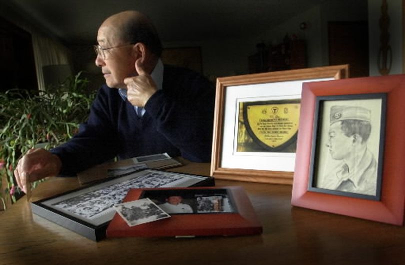 A lifelong resident of Spokane, Fred Shiosaki reflects on his service in the Army during WWII in the European Theatre. Fred is sitting in his living room looking out over his back yard 4/9/01. The photos are part of his memorabilia at his home in the Valley.
 
 (File)